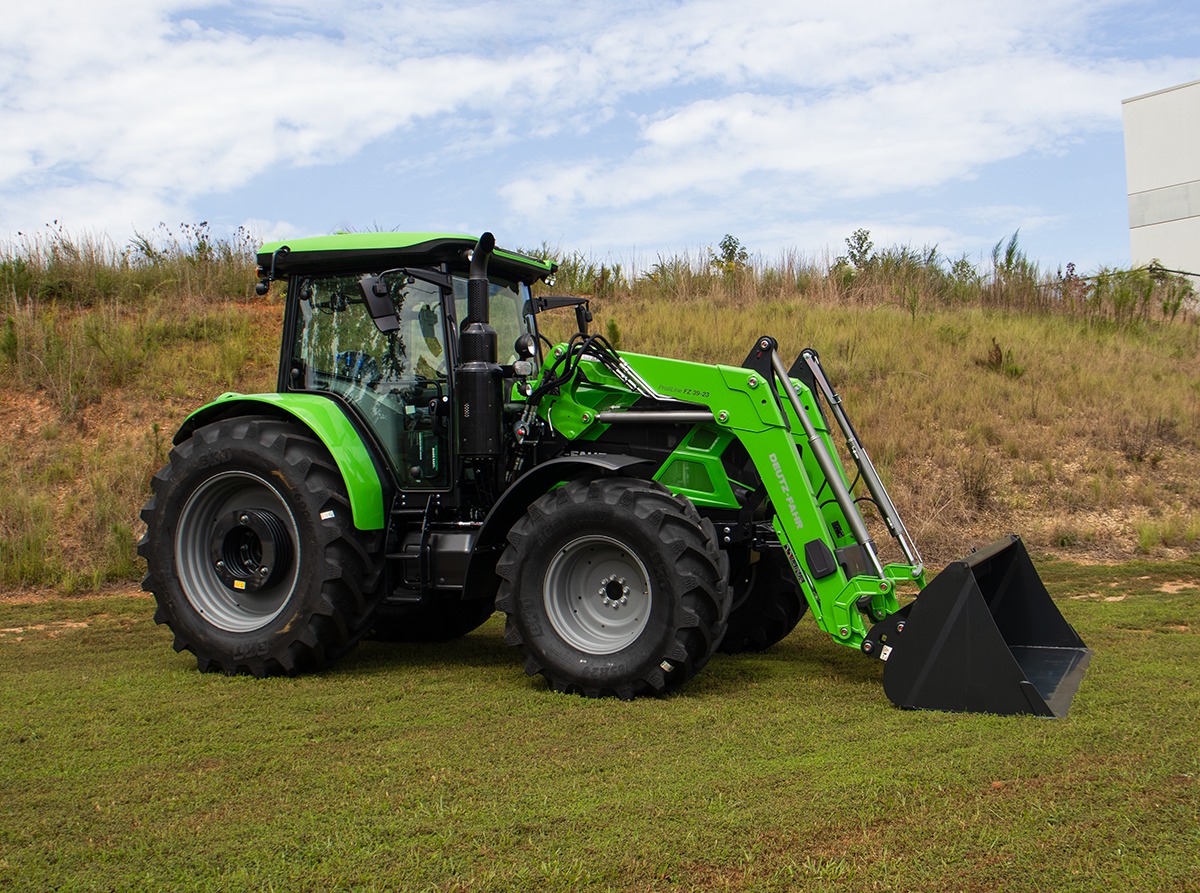 Deutz-Fahr tractor with front loader parked on grassy field